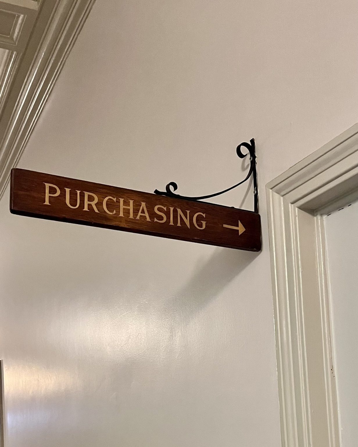 Wooden sign indicating a purchasing department