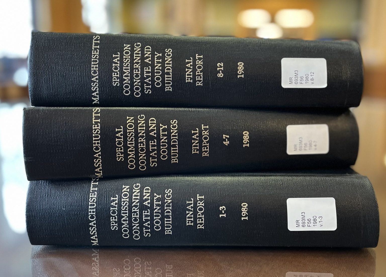 Three books containing the Ward Commission report lying horizontally